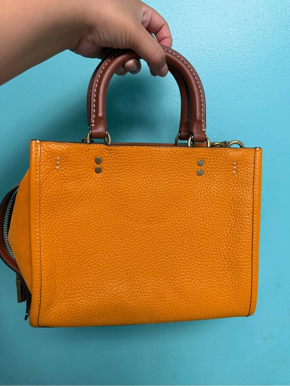 Coach Pebbled rouge 25 in papaya orange